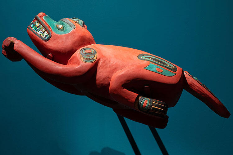 Close-up of the carved wooden replica of the original beaver prow.