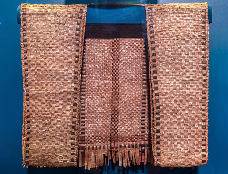 Woven cedar vest with wide front panels.