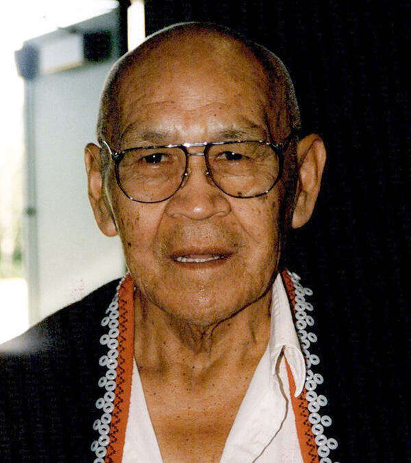 Portrait of an older man with glasses.