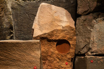 Red quartzite rock specimens from Hall of Planet Earth.