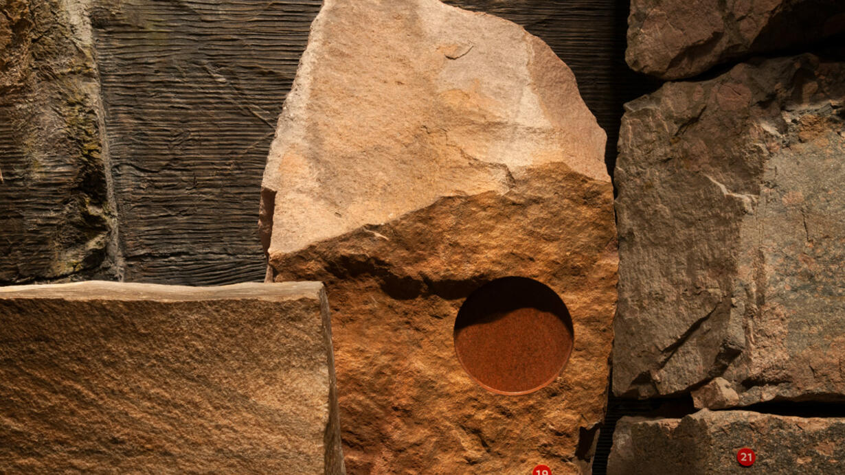 Red quartzite rock specimens from Hall of Planet Earth.