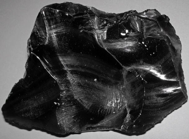 Large piece of glossy, obsidian rock.
