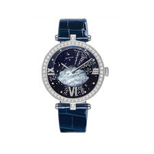 A watch with a jewel encrusted bezel, a cloud behind the hands and small stars around the dial.