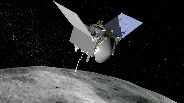 OSIRIS-REx hovers above the stony surface of the asteroid in a star-filled background.
