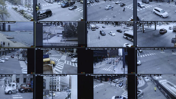 Multiple screens show the activity on various street corners.
