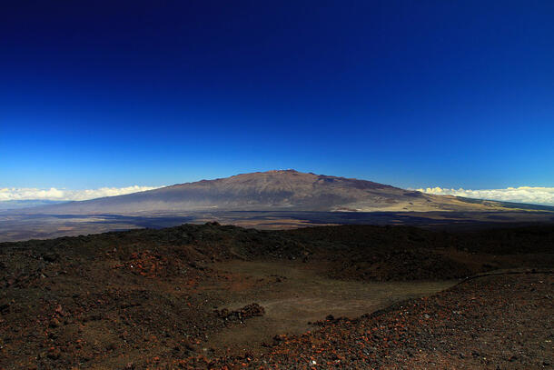 View of the mountainous Mauna Kea volcano in the distance.