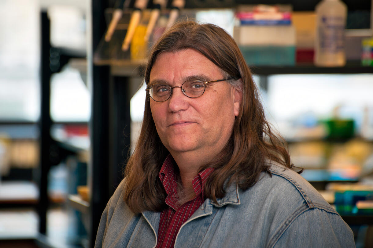 A photo of Museum curator Rob DeSalle, facing the camera.