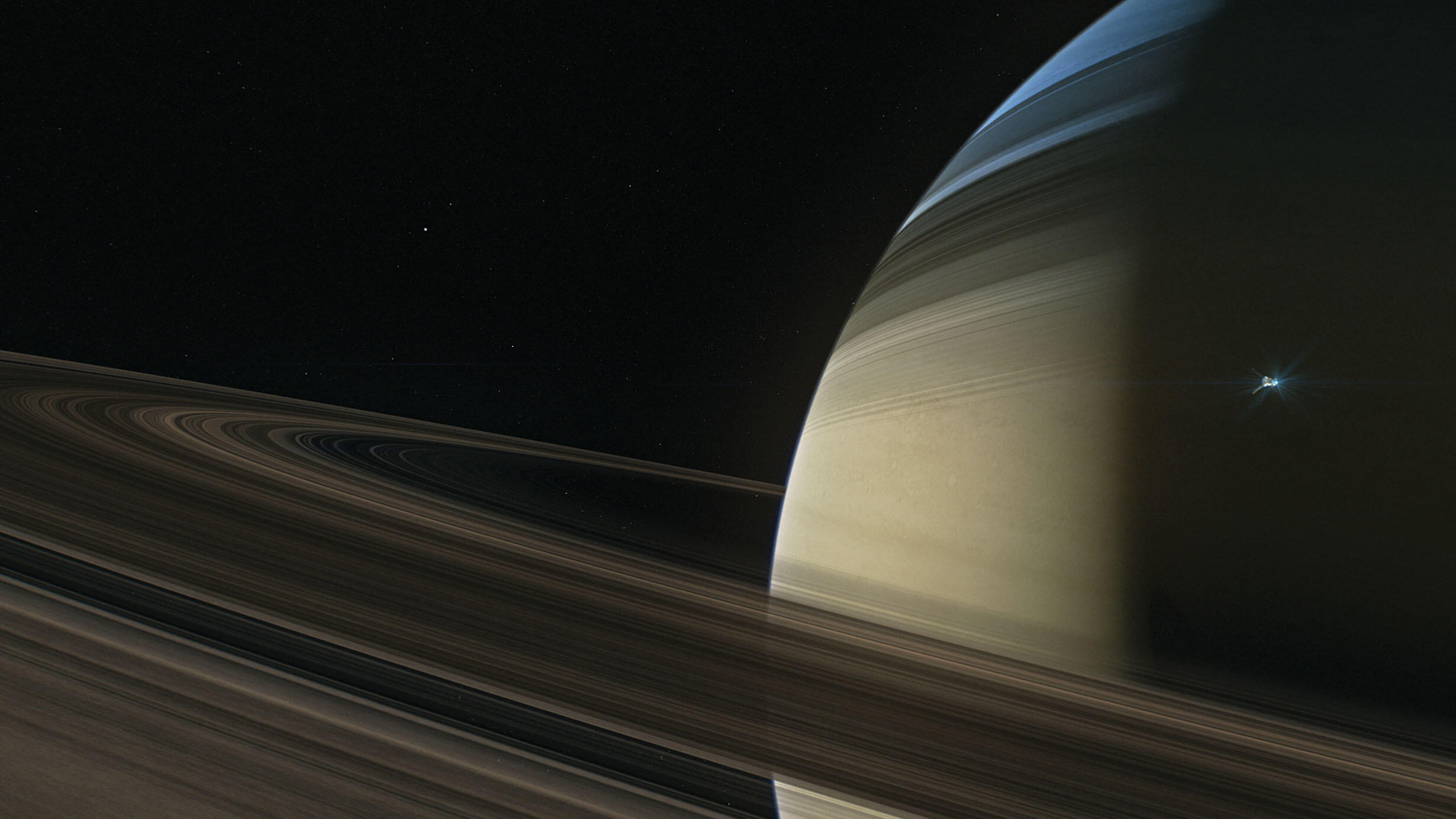 A rendering of the Cassini orbiter flying above Saturn’s rings. 