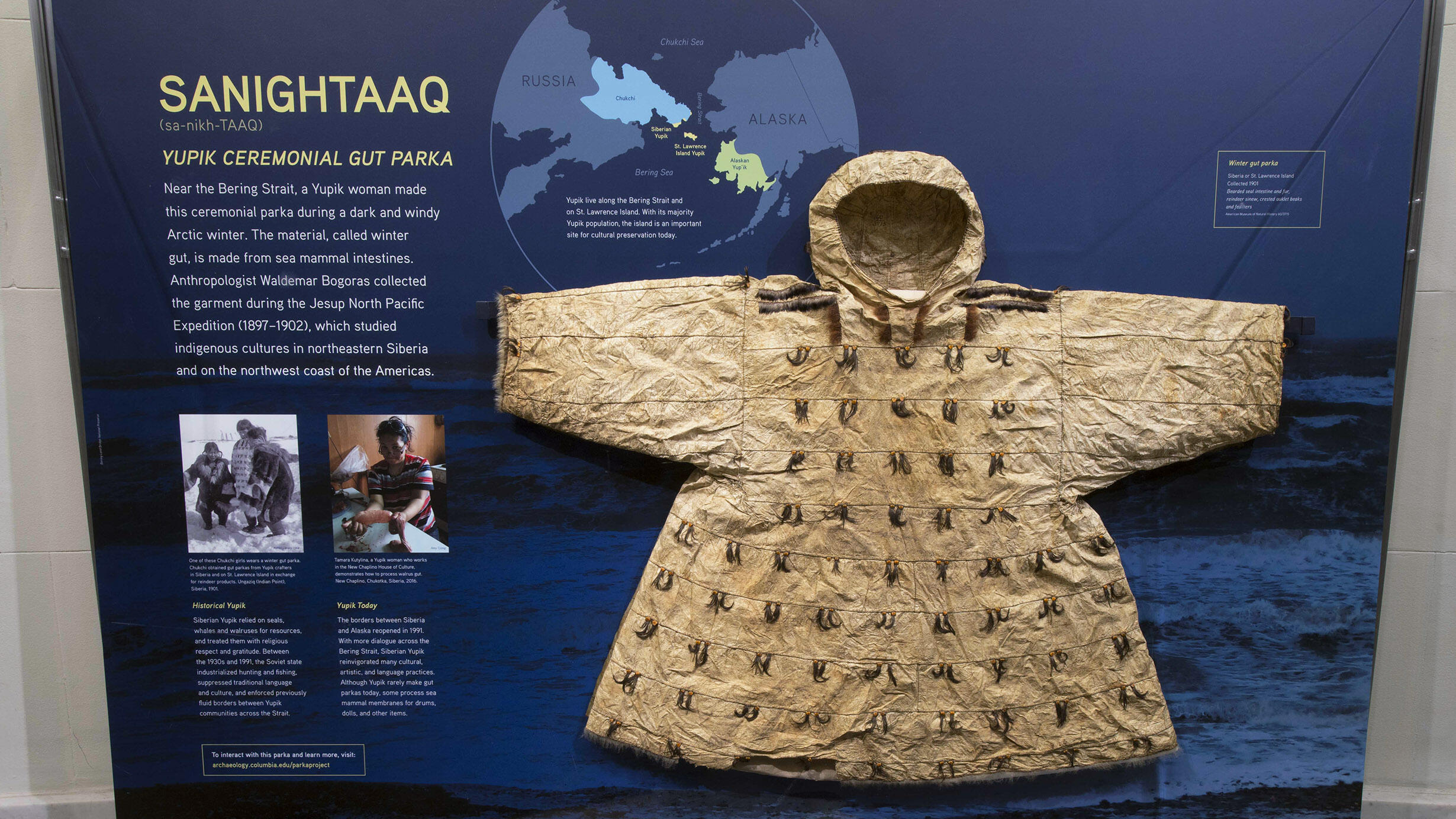 Yupik parka mounted in display case.