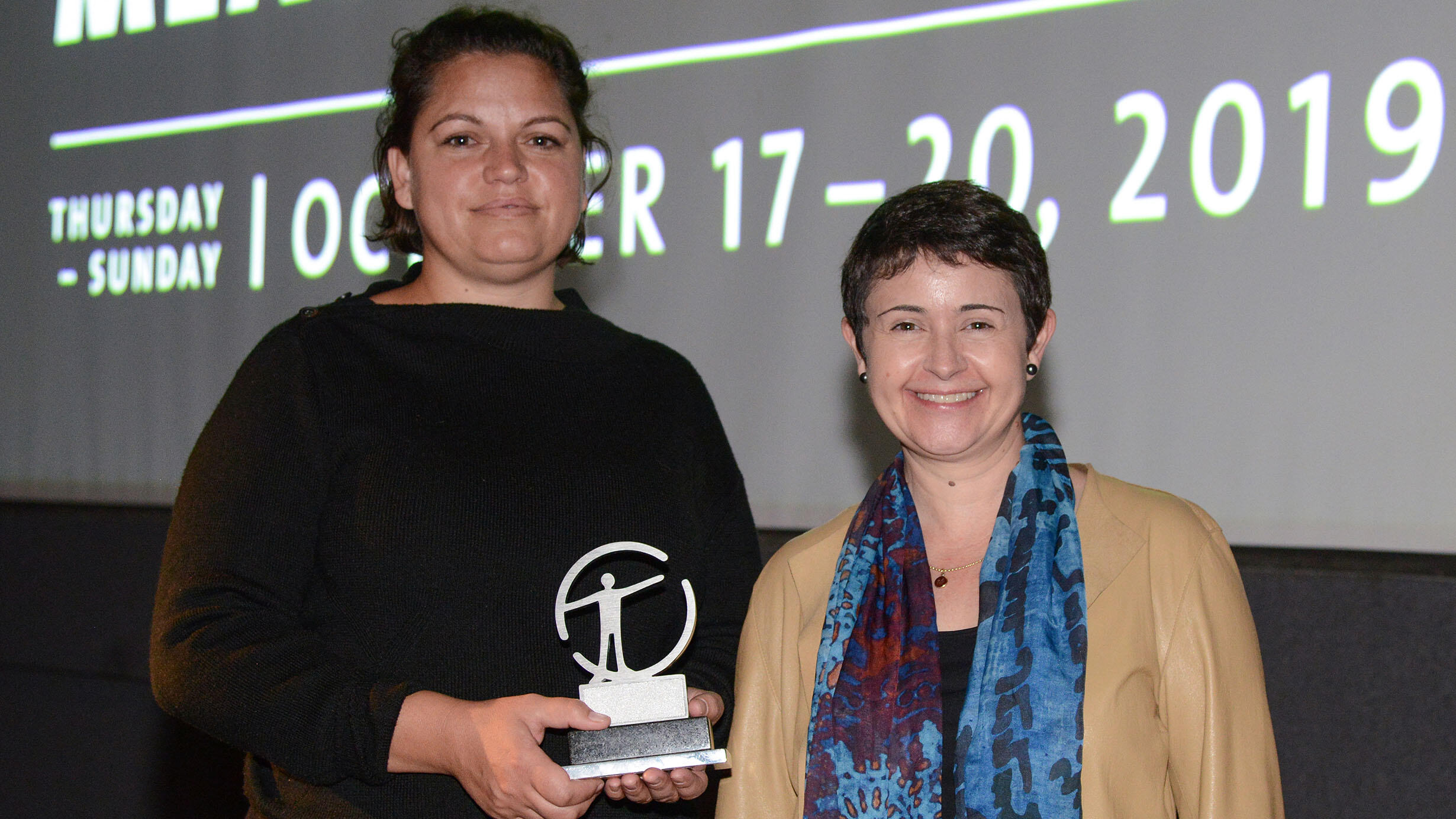 Tanith Glynn-Maloney holds her Margaret Mead filmmaker award.