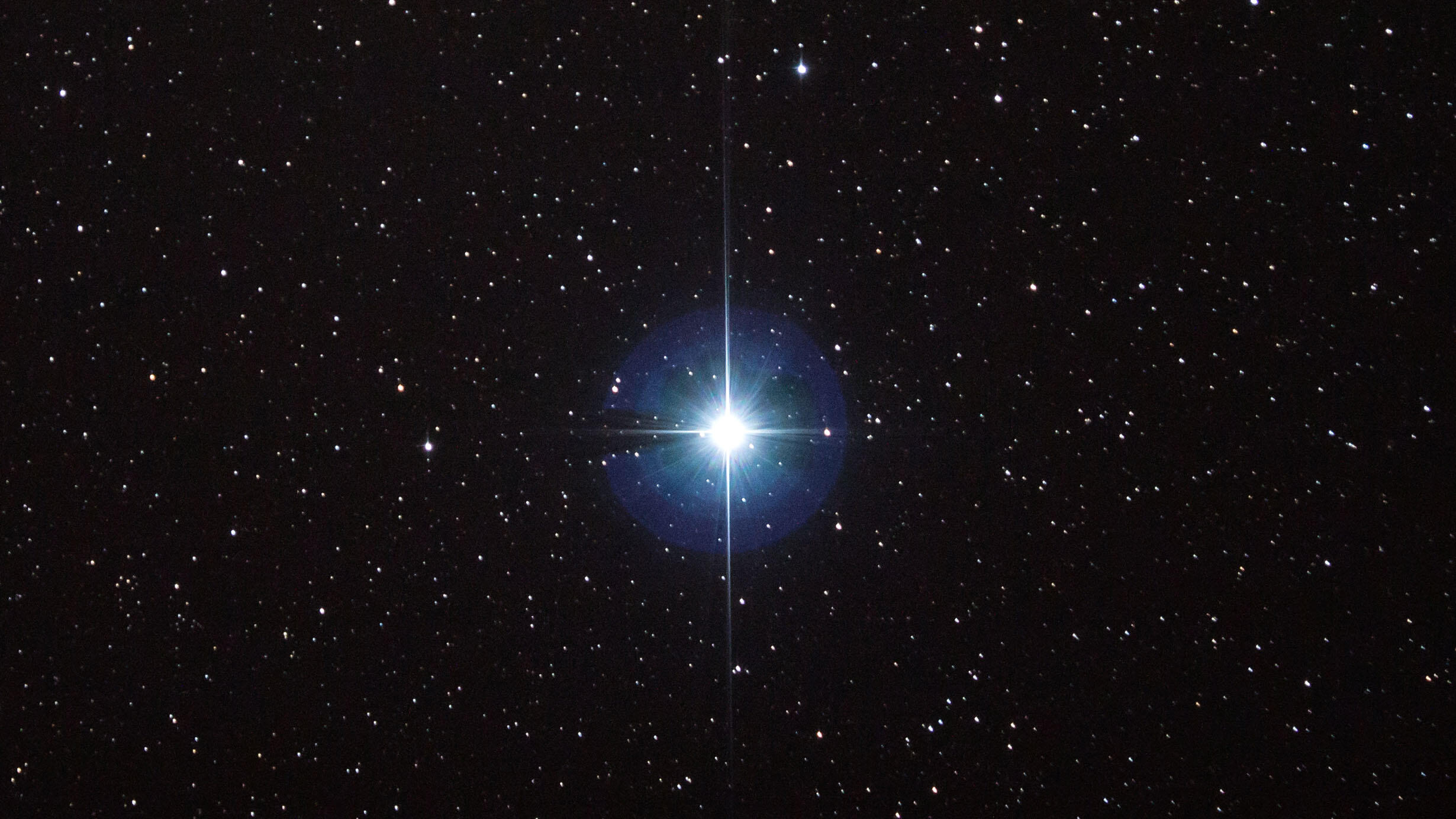 Star shines brightly in space.