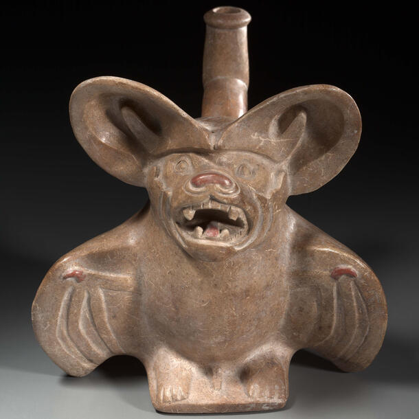 Clay vessel constructed in the shape of a large-eared, displaying its fangs and opening its wings.