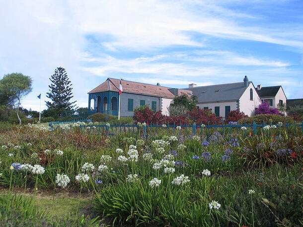 A large house surrounded by flowers, Longwood, the residence of Napoleon while in exile on St. Helena.