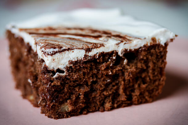 Square of cake with icing.