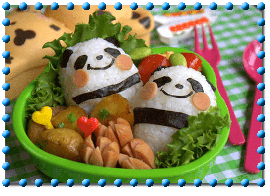 bento box with 2 rice balls decorated to look like pandas