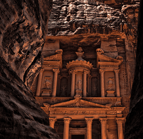 As you enter Petra, a shadowy canyon opens up to a majestic monument.