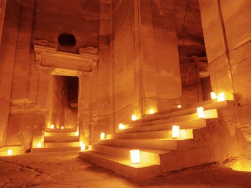 stone steps and doorways inside the Treasury lit up with candles