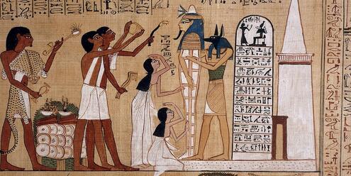 Egyptian papyrus painting of the god Anubis and four attendants preparing a mummy. 