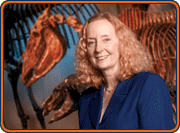 Dr. Sandra Olsen in front of horse skeleton