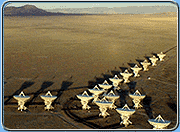 radio telescopes lined up out in the desert