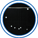 Sideview of a mobile with 7 balls hanging at varying lengths from a posterboard