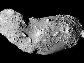 Oblong asteroid on black background