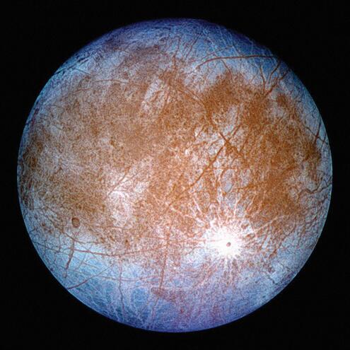 Europa, a moon with brown center and blue perimeter 