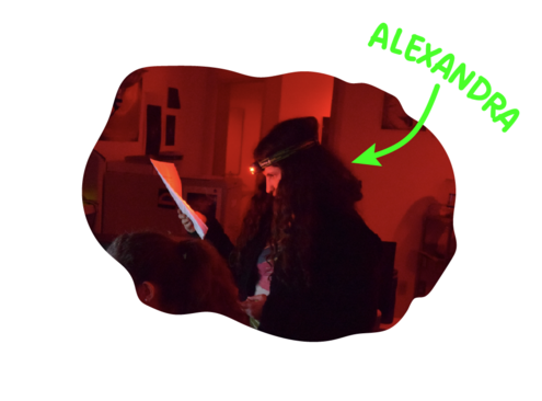 Photo of young girl with curly brown hair analyzing a chart
