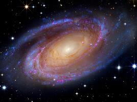 A swirling spiral-type galaxy in space.