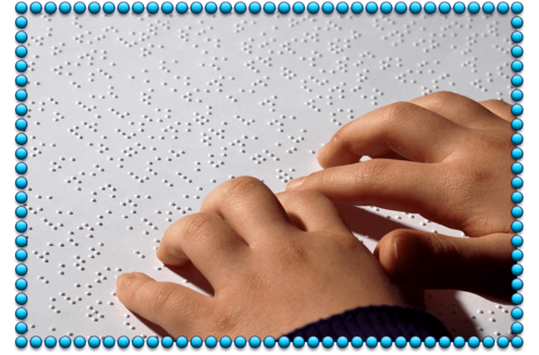 Hands reading Braille