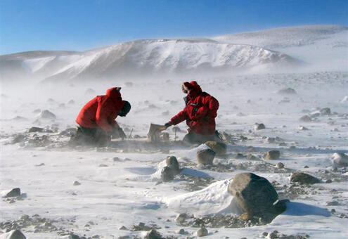 scientists out in the wind of Antarctica