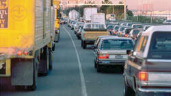 Cars and trucks on a traffic filled highway