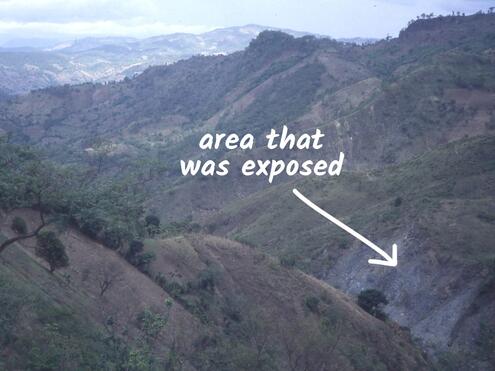 mountainside after a landslide caused by hurricane with newly exposed jade deposits