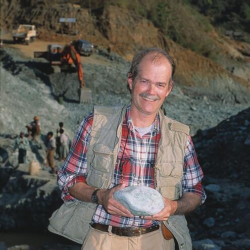 George Harlow holding a large chunk of jade