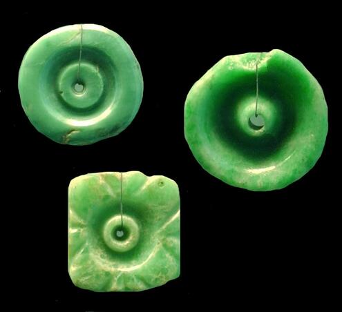 bright green carved Mayan ear spools