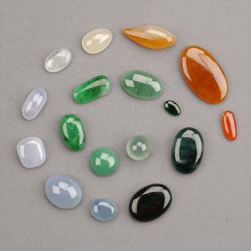small polished jade in colors ranging from white, lavender, green, orange to almost black