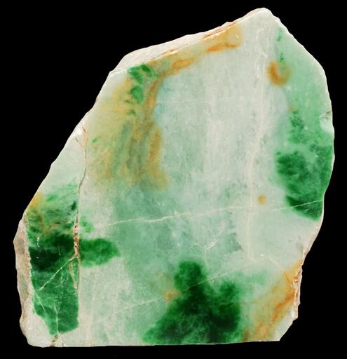 chunk of jade with different colored patches of white, orange and green
