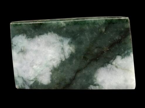 retangular chunk of dark green jade with large white patches