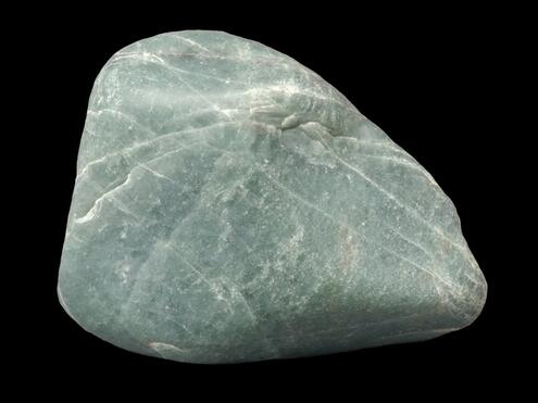 smooth chunk of pale grey-green jade with thin whitish veins