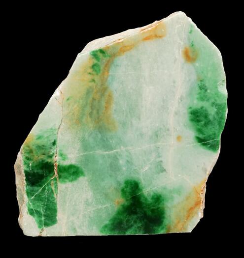 chunk of jade in patches of white, vivid dark green, and orange