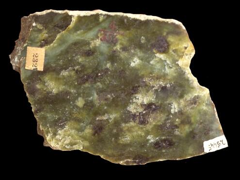 chunk of jade with mottled colors of green, black and white
