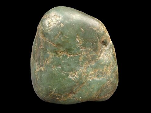 egg shaped chunk of light green jade with yellowish veins