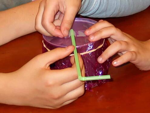 taping the flexible straw in place