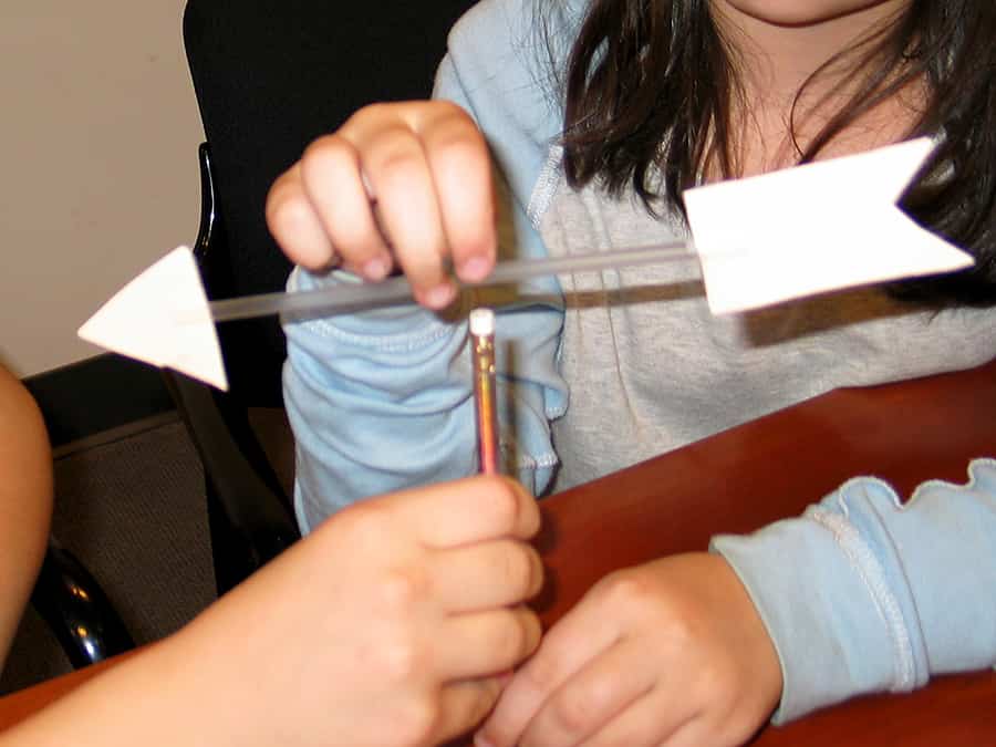 pinning arrow into eraser top of pencil