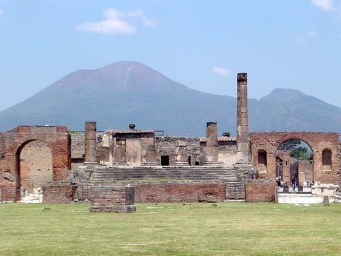 Ancient ruins of Pompei with Mt. Vesuvius behind in the distance