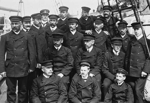 many of the crew members posing in uniform