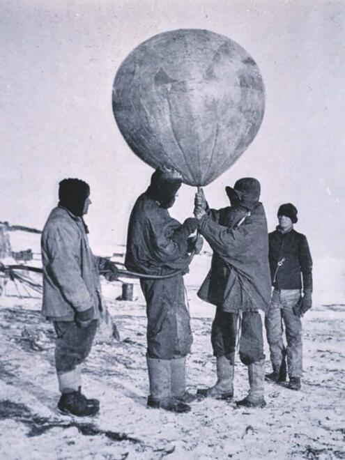 crew holding weather balloon