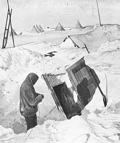 crew member standing in front of entrance hatch into the underground village under the ice