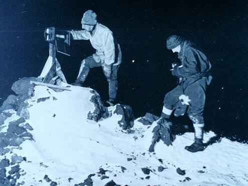 recording temperatures on a snowy hilltop