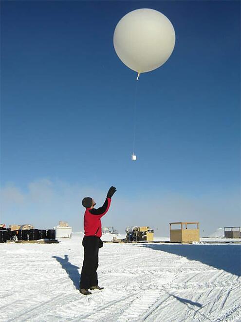 scientist releasing balloon